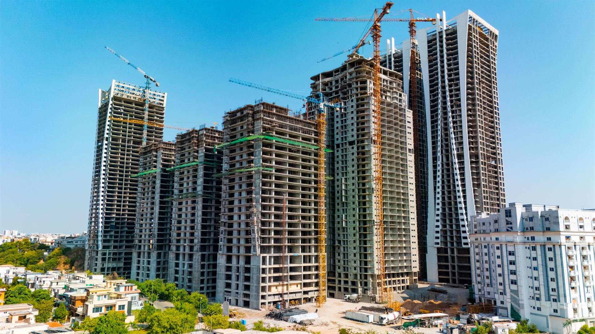 The Goldcrest Views towers under construction with tower cranes